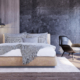 Image of a bedroom interior with black stone wall, ceiling side lamps and wooden floor