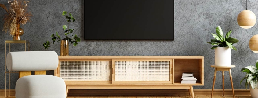 TV and wooden cabinet with gray armchair in modern living room the concrete wall