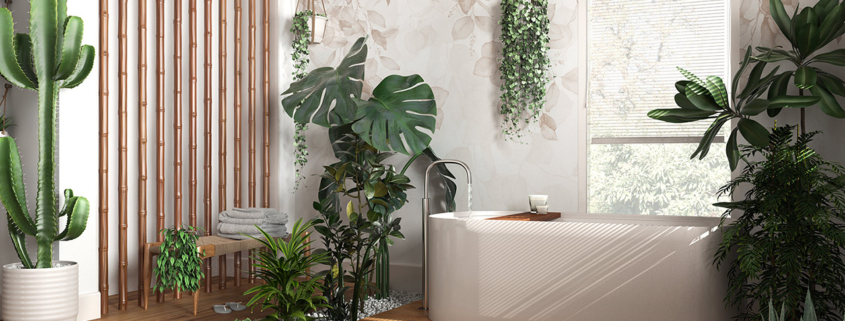 Modern wooden bathroom in white and beige tones with freestanding bathtub and bamboo wall.