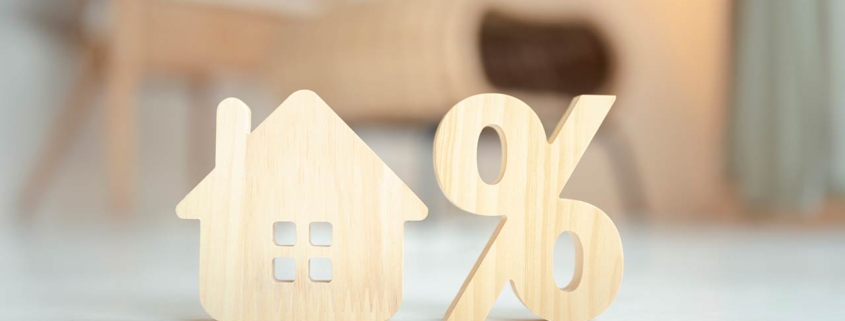 Percentage and house sign symbol icon wooden on wood table